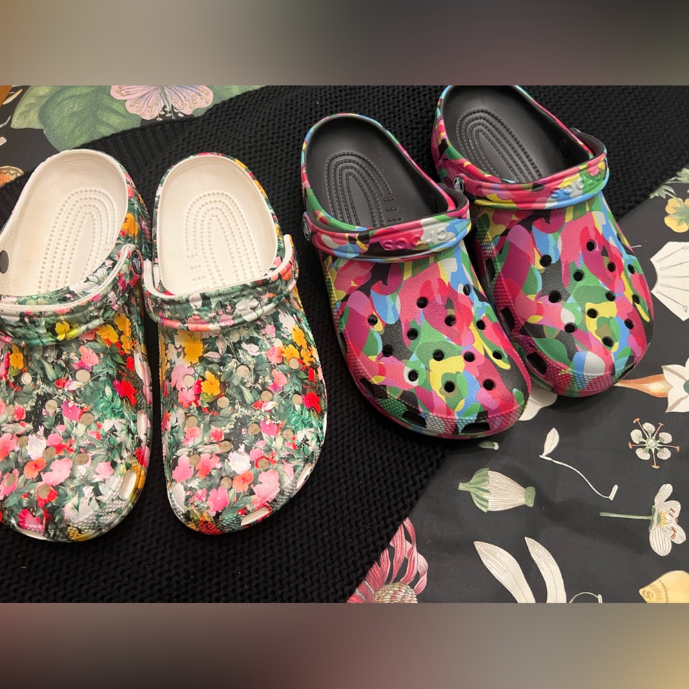 2 pairs of Crocs Size 10, Floral and Geometric Patterns.